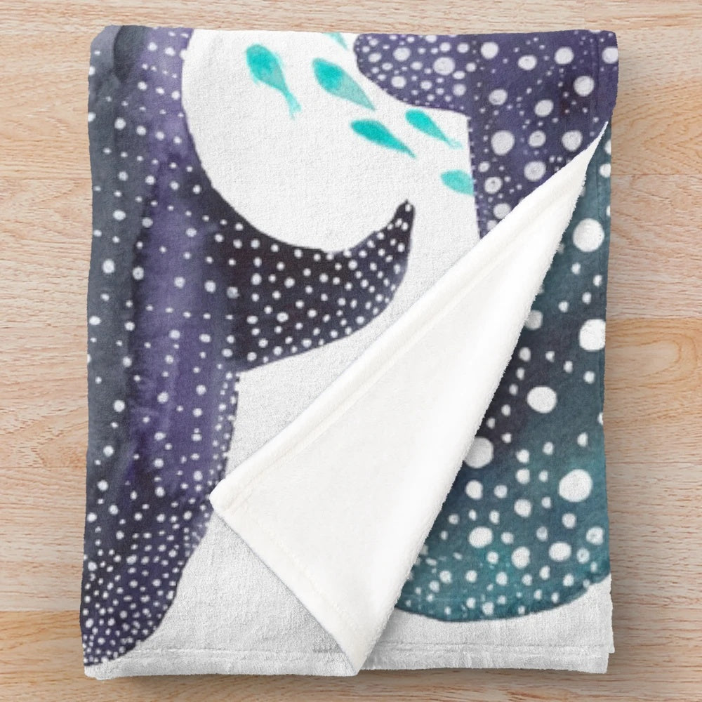 Watercolor print plush blanket featuring whale shark, ray, and other ocean creatures