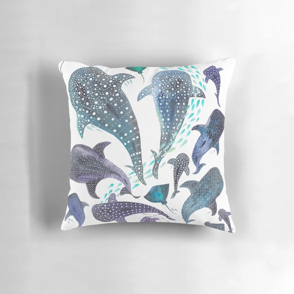 Decorative throw pillow featuring a watercolor-style illustration of a whale shark, ray, and other marine life.
