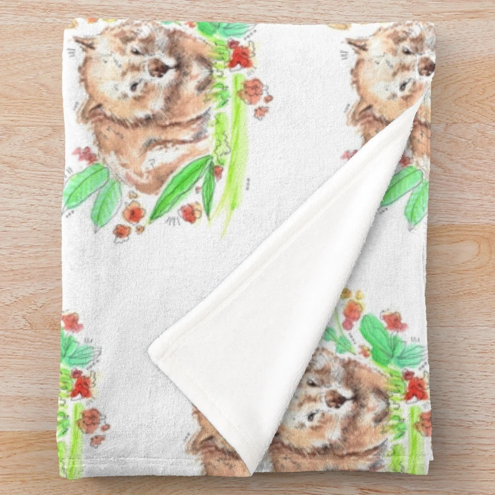 Watercolor illustration of a cute wombat on a plush, soft blanket