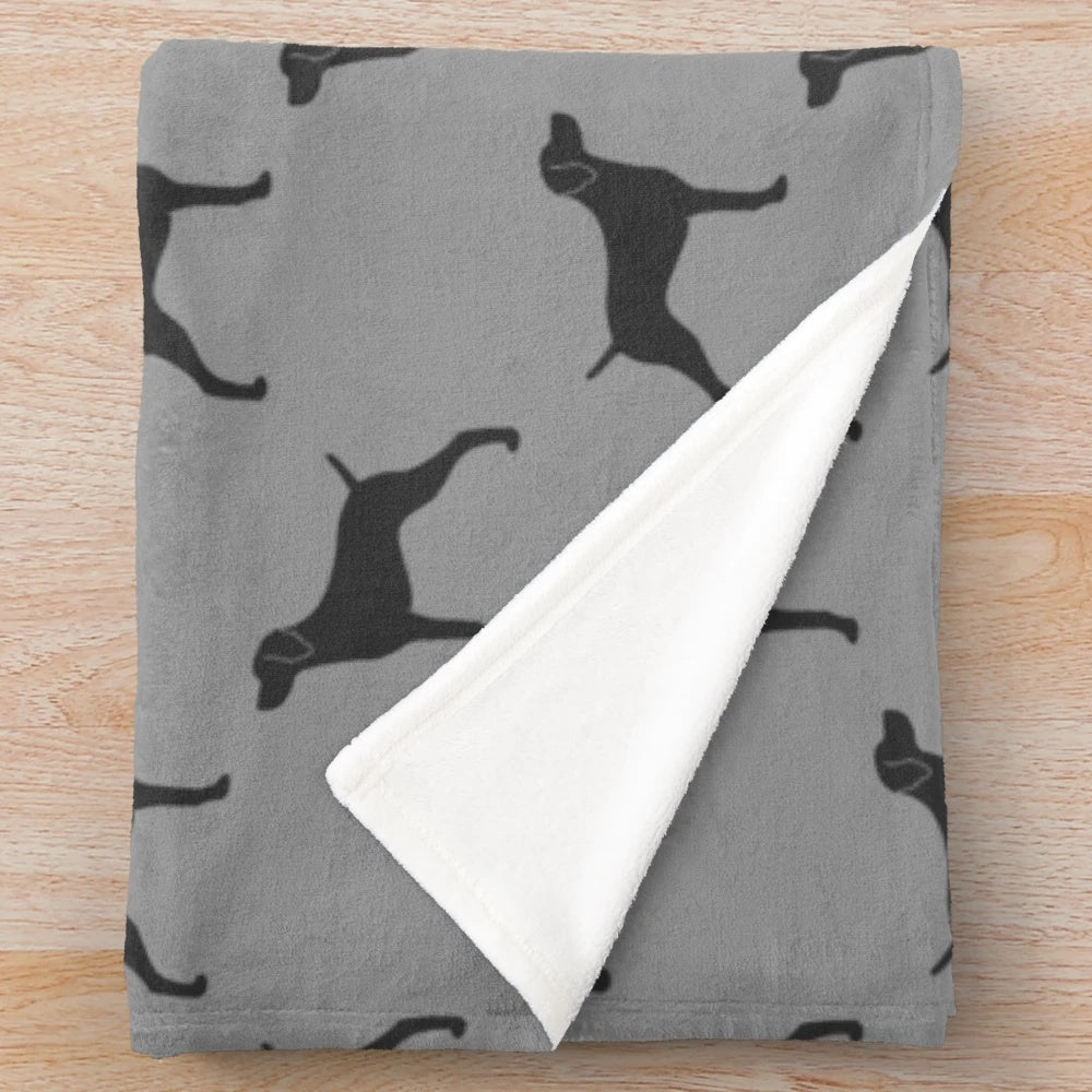 Weimaraner dog breed silhouette design on a plush blanket