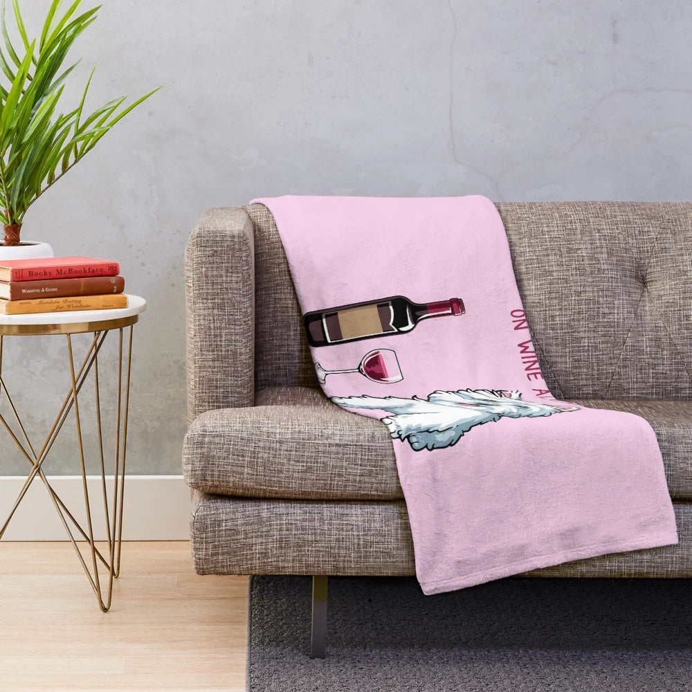Westie dog on a plush blanket with a wine glass design