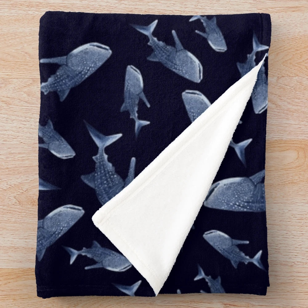 Navy blue plush blanket with a whale shark pattern design
