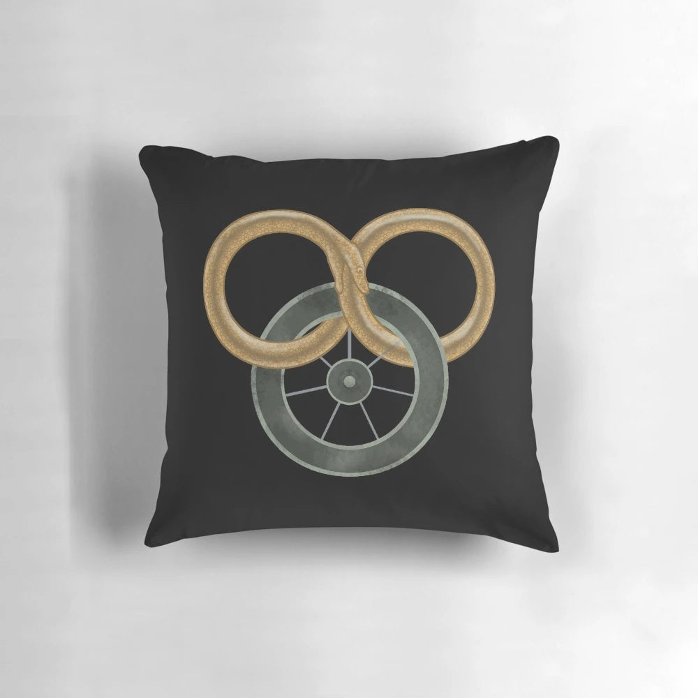 Stylized illustration of the Wheel of Time symbol on a decorative throw pillow