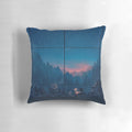 A cozy pillow featuring a serene mountain landscape with fog, trees, and sunlight at dawn.