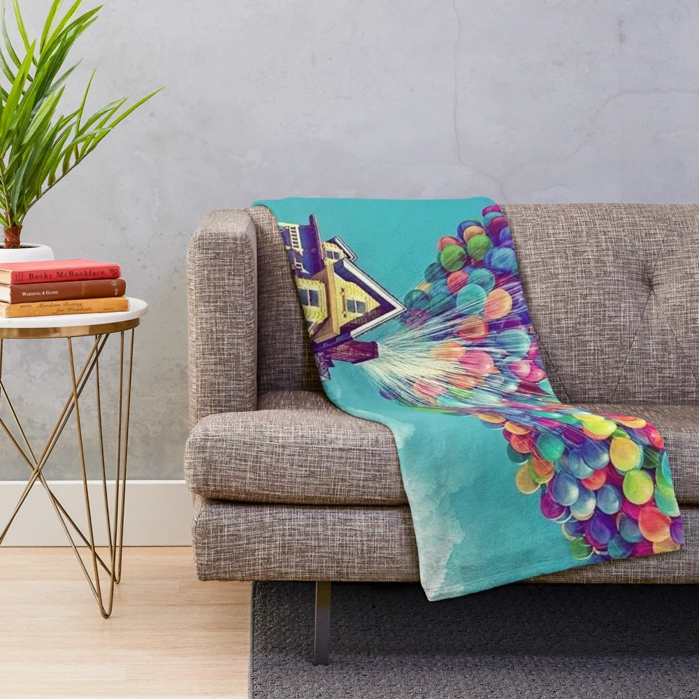 Soft, plush blanket with a whimsical air-themed design, inspired by the Disney movie "Up