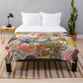 Colorful plush blanket featuring an Alice in Wonderland inspired collage design