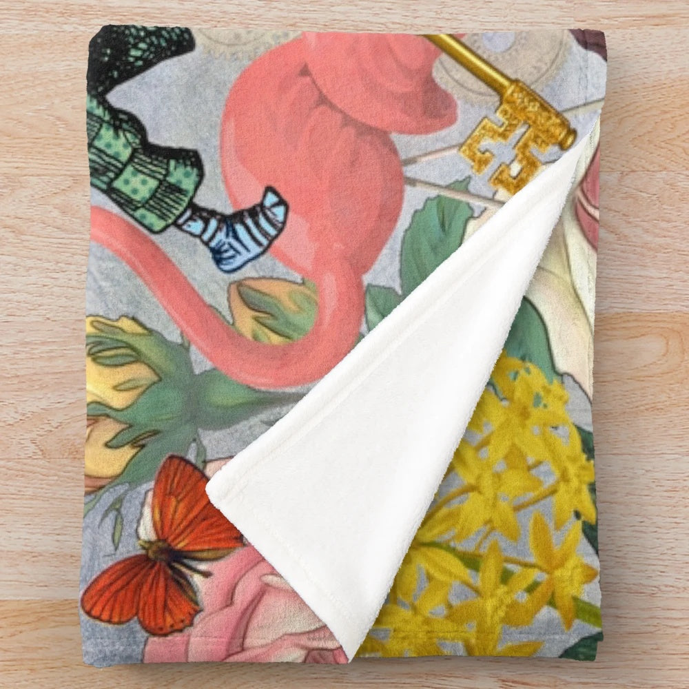 Colorful plush blanket featuring an Alice in Wonderland inspired collage design