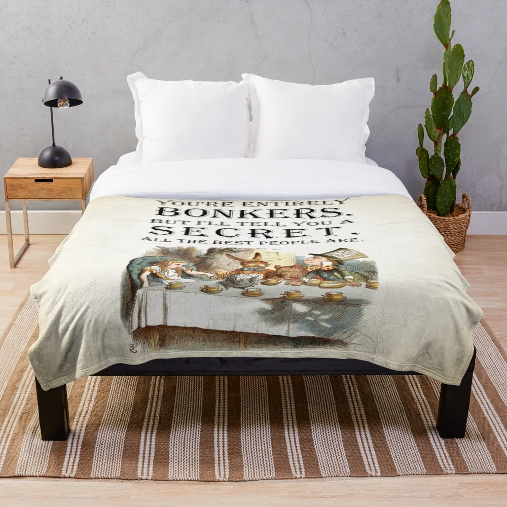 Alice in Wonderland inspired plush blanket with "You're Entirely Bonkers" quote