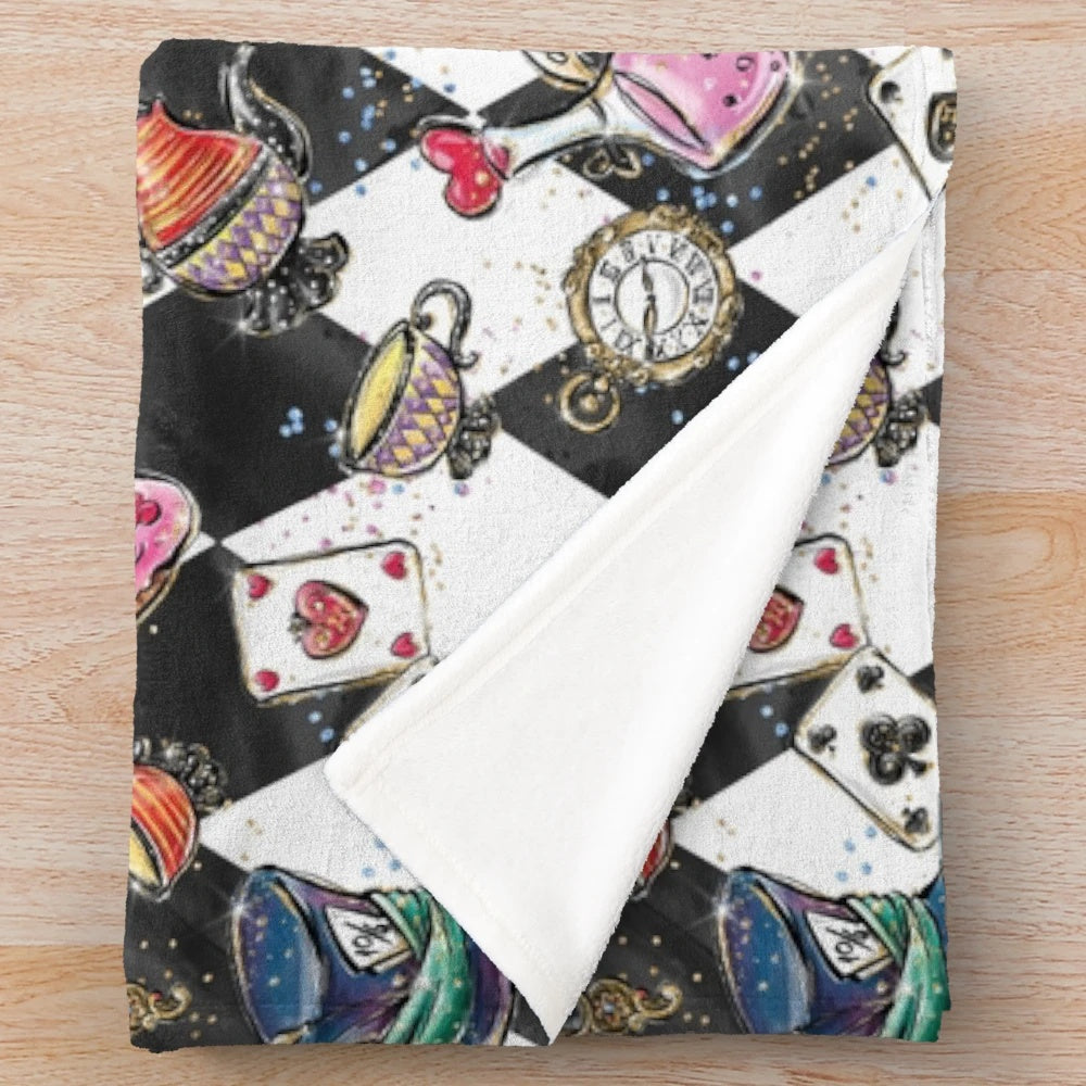 Whimsical Alice in Wonderland inspired plush blanket featuring trippy, psychedelic designs and cheshire cat, mad hatter elements