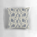 A blue pillow featuring a whimsical alien abduction-themed toile de jouy pattern.