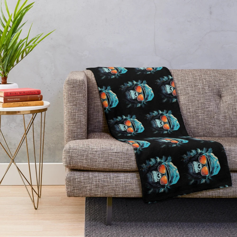 Cute animal plush blanket featuring a fun ape character in a hat and glasses