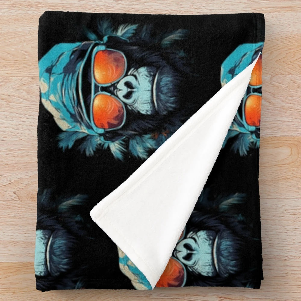 Cute animal plush blanket featuring a fun ape character in a hat and glasses