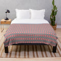 Whimsical argyle plush blanket in pink, gray, and gold