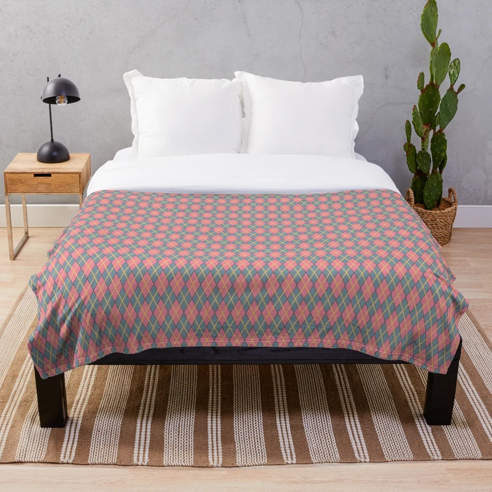 Whimsical argyle plush blanket in pink, gray, and gold