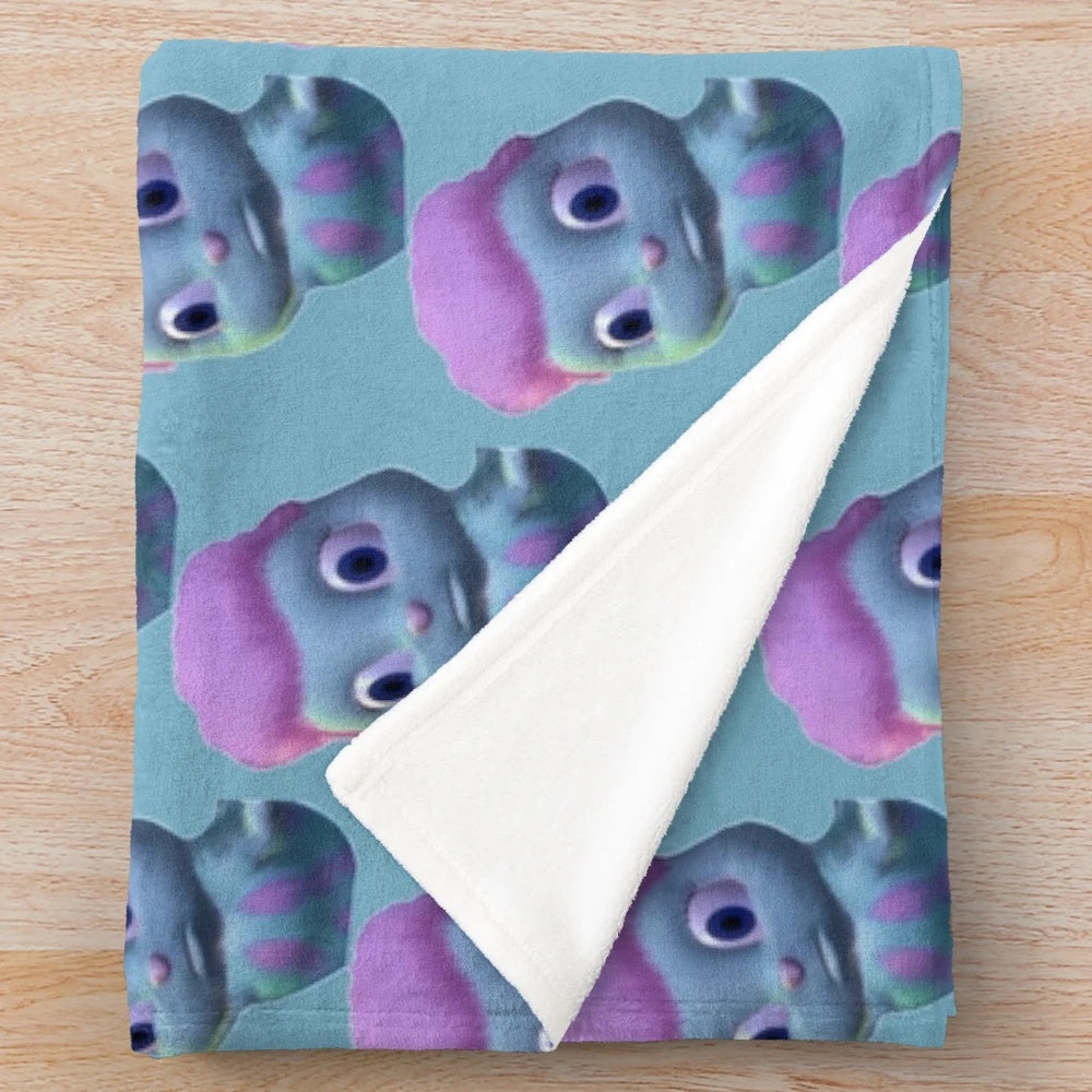 Whimsical Barbie-inspired plush blanket with a concerned facial expression