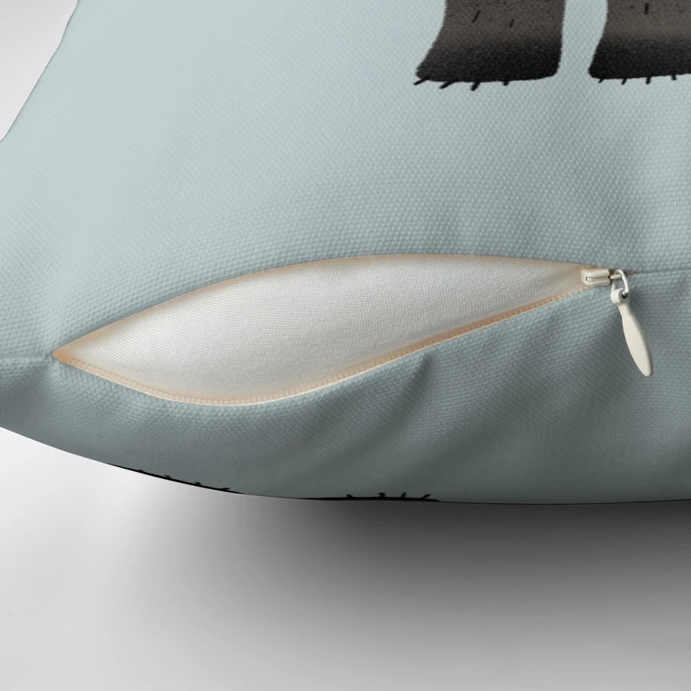 Charming pillow featuring a bear, trees, and a crescent moon in a night sky