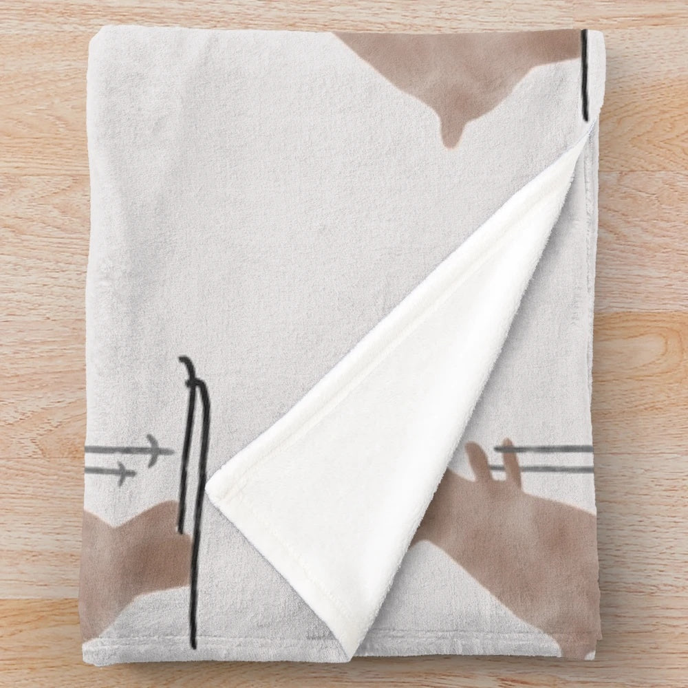 A whimsical plush blanket featuring a watercolor-style illustration of a bear on skis in a snowy, winter landscape