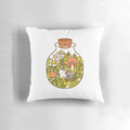 A soft, plush pillow featuring a delightful bunny in a glass bottle, surrounded by lush foliage and nature-inspired elements.