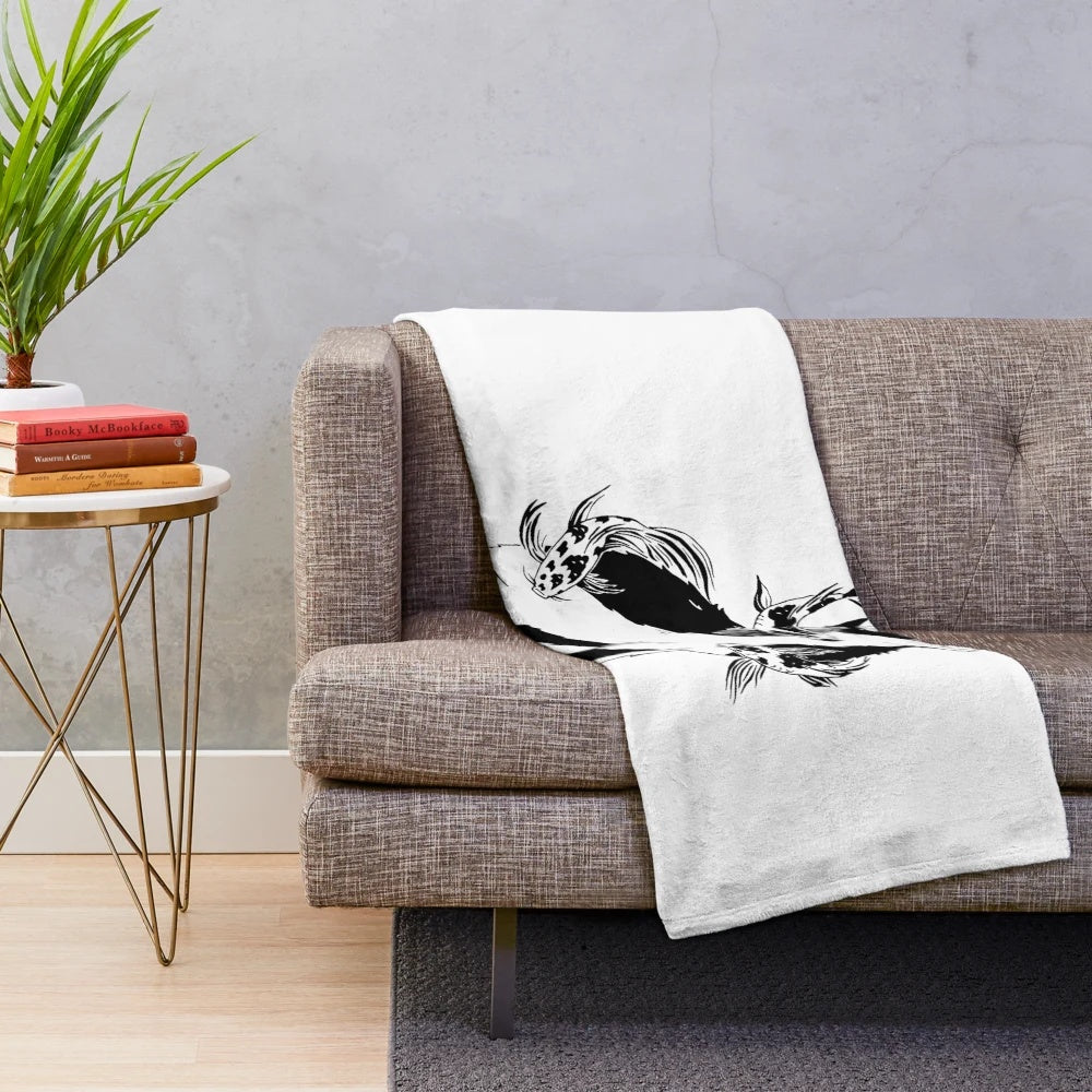 Charming ink illustration of a cat and fish on a plush blanket