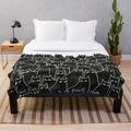 Whimsical black and white cat pattern plush blanket