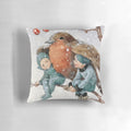 A decorative pillow featuring a charming illustration of Christmas elves sheltering with a robin in a snowy woodland setting.