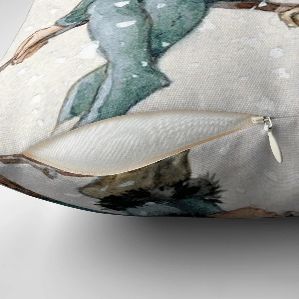 A decorative pillow featuring a charming illustration of Christmas elves sheltering with a robin in a snowy woodland setting.