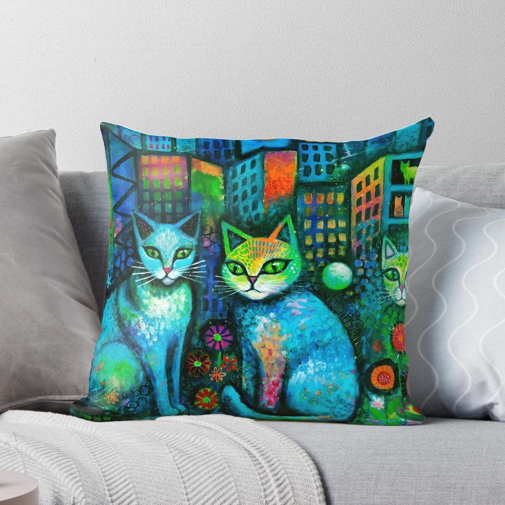 A colorful, abstract and surreal pillow design featuring cats under the moonlight in an urban setting.