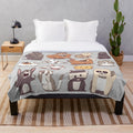 Colorful animal plush blanket with cute, whimsical forest creature designs