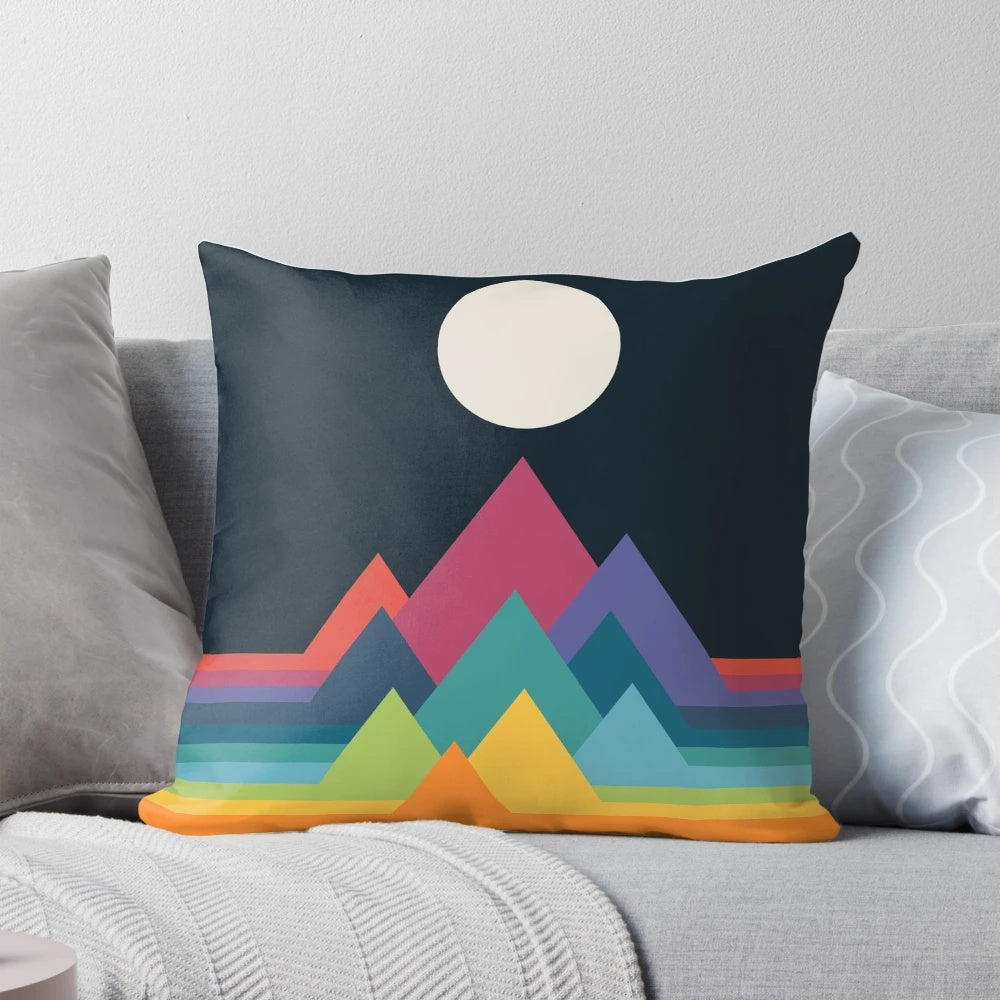 Whimsical and colorful mountains printed on a decorative throw pillow for a dreamlike, fantasy-inspired home decor.