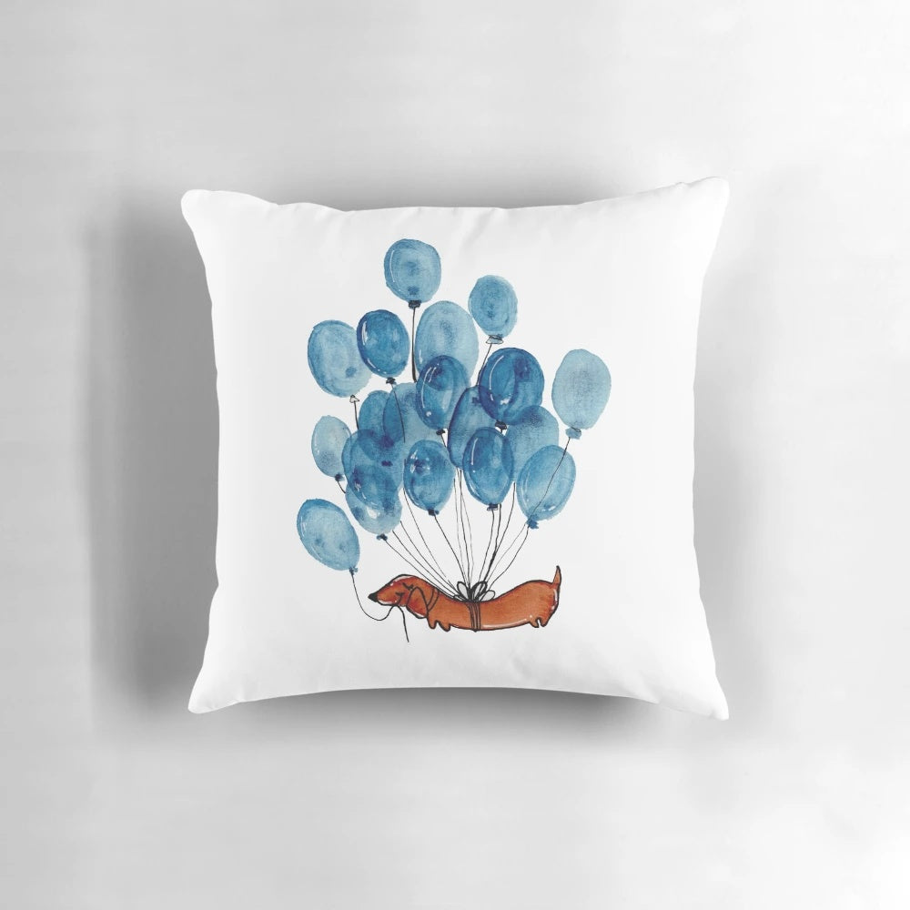 Illustration of a dachshund dog surrounded by blue balloons on a throw pillow