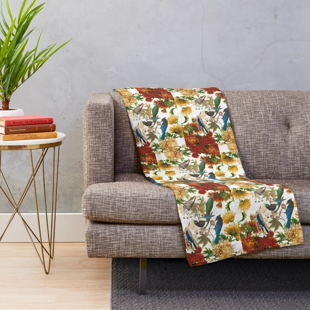 Plush blanket with a whimsical design of dancing animals and floral patterns