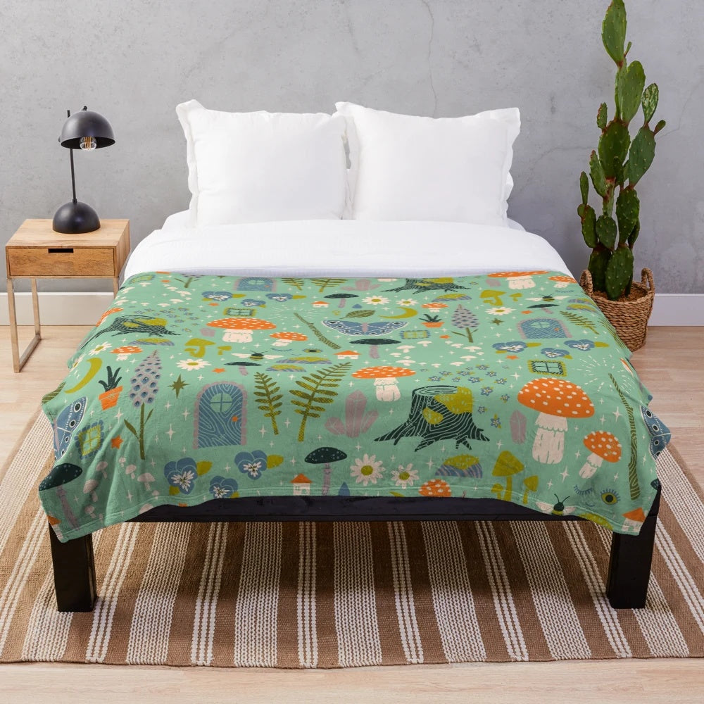 Fairy garden plush blanket with whimsical floral pattern