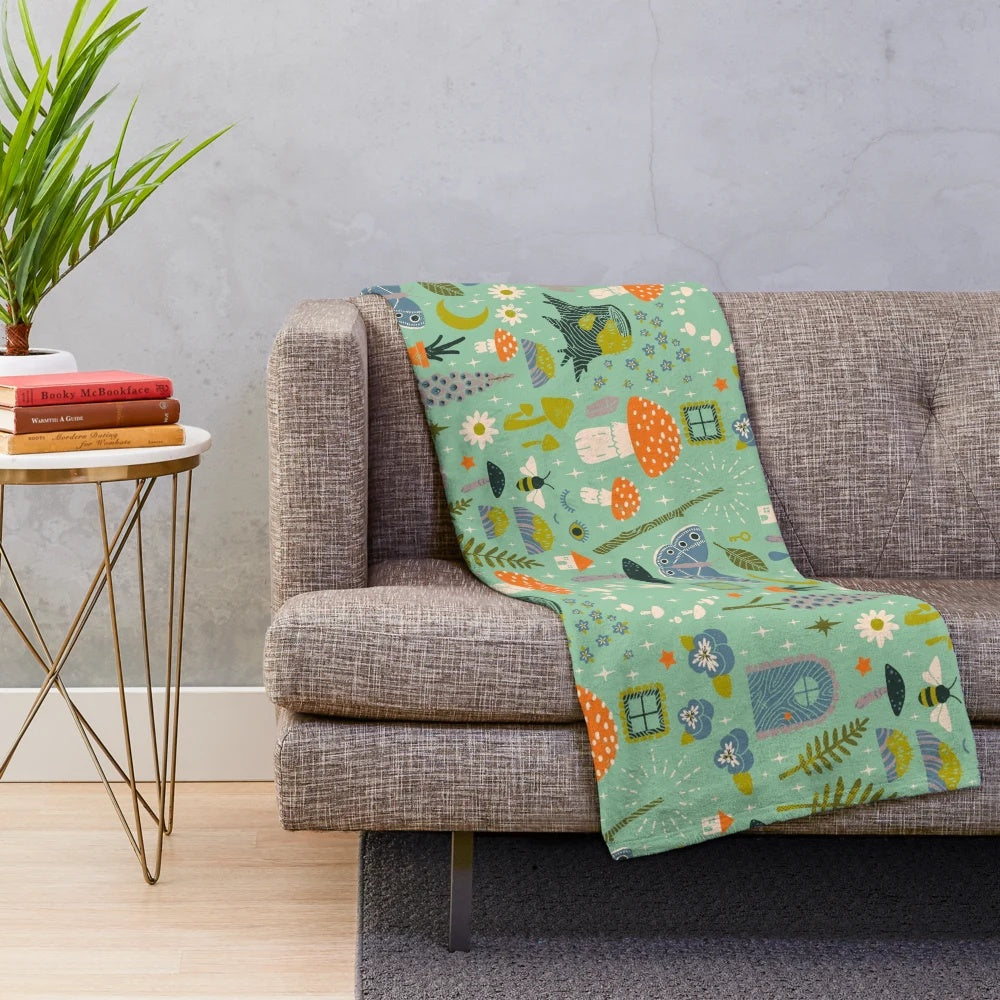 Fairy garden plush blanket with whimsical floral pattern