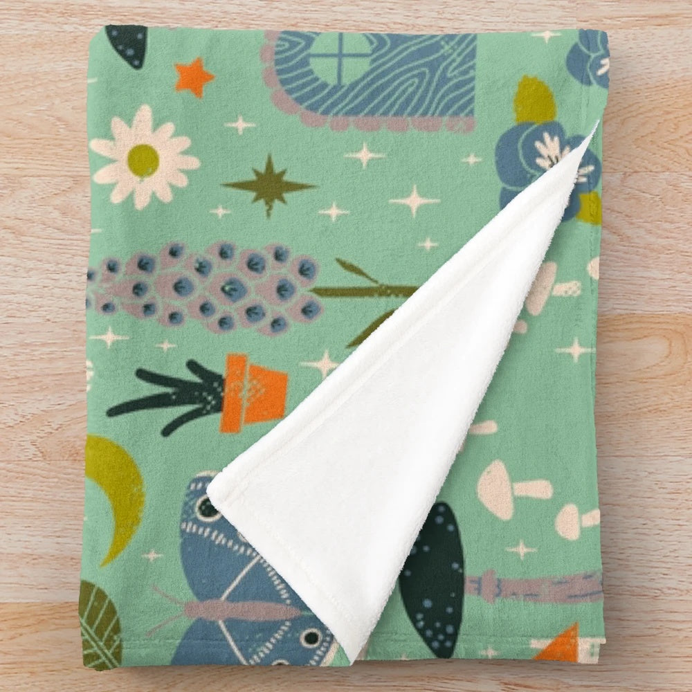 Fairy garden plush blanket with whimsical floral pattern