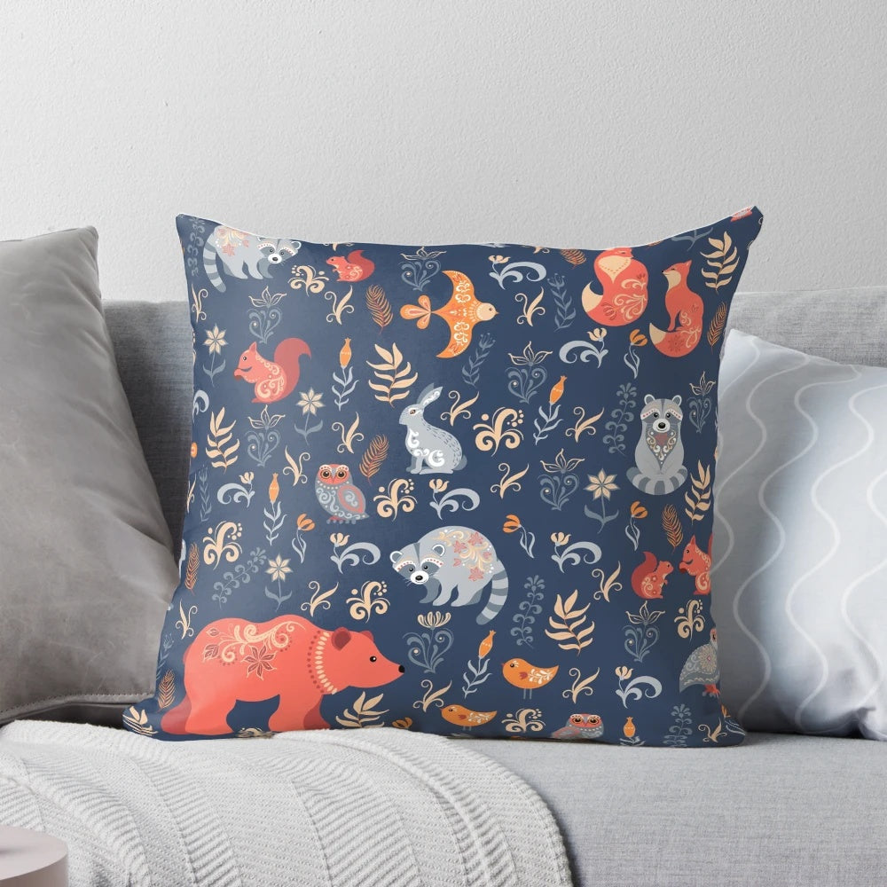 Decorative blue background pillow featuring a charming pattern of forest animals like foxes, bears, raccoons, owls, and rabbits.