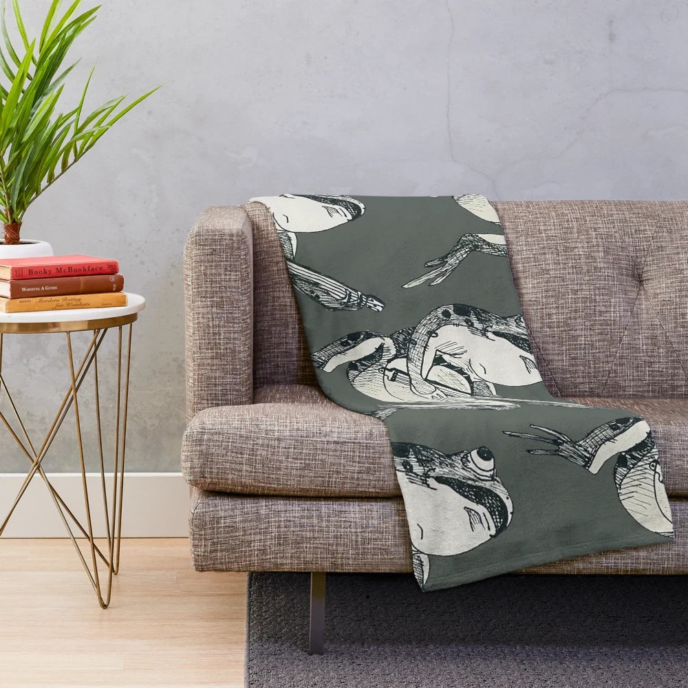 A plush blanket featuring a whimsical fairytale frog playing a banjo in a woodland setting
