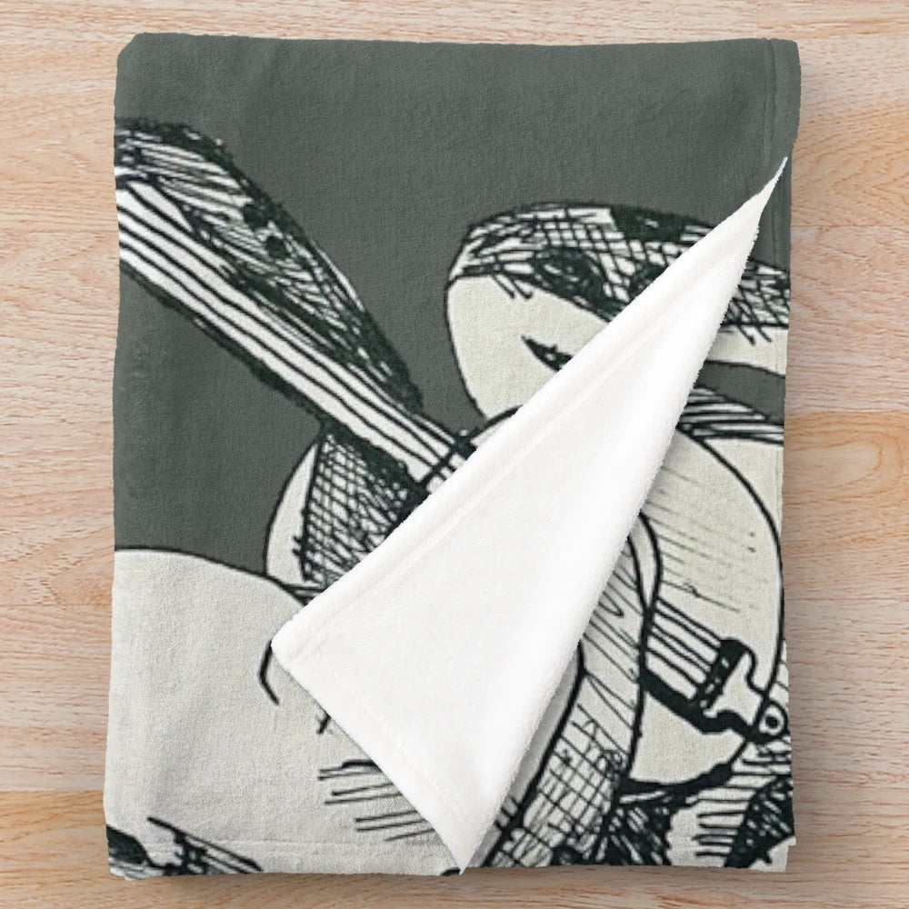 A plush blanket featuring a whimsical fairytale frog playing a banjo in a woodland setting