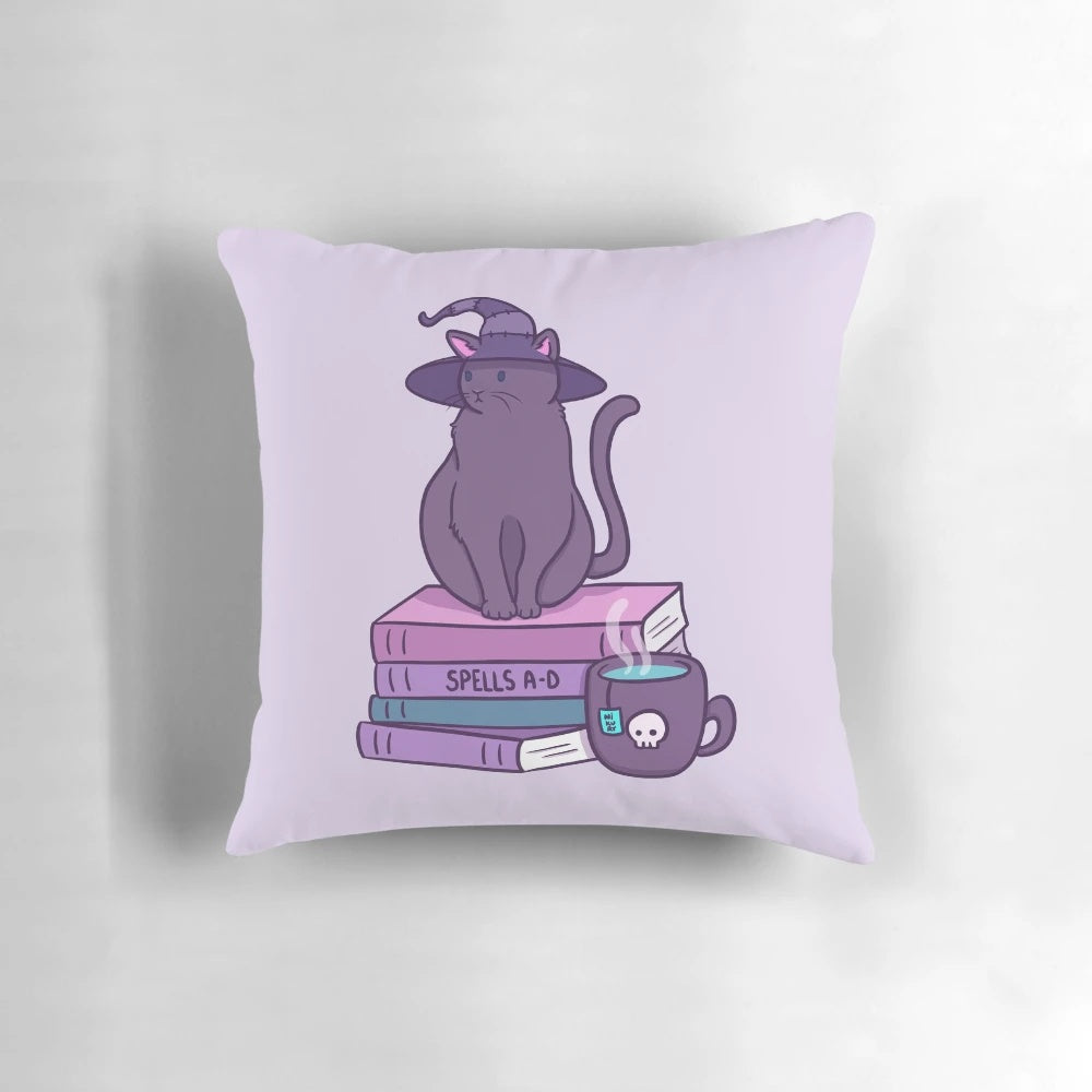 A soft, plush pillow featuring a whimsical illustration of a cat witch with a purple and pastel color scheme.