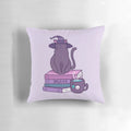 A soft, plush pillow featuring a whimsical illustration of a cat witch with a purple and pastel color scheme.