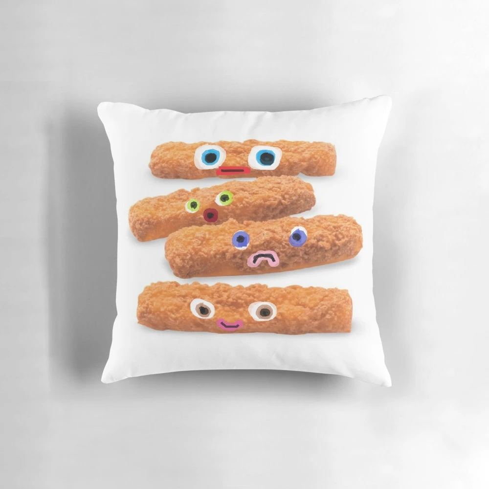 A plush pillow featuring a design of colorful "fish sticks with faces" in shades of orange, blue, green, and pink.