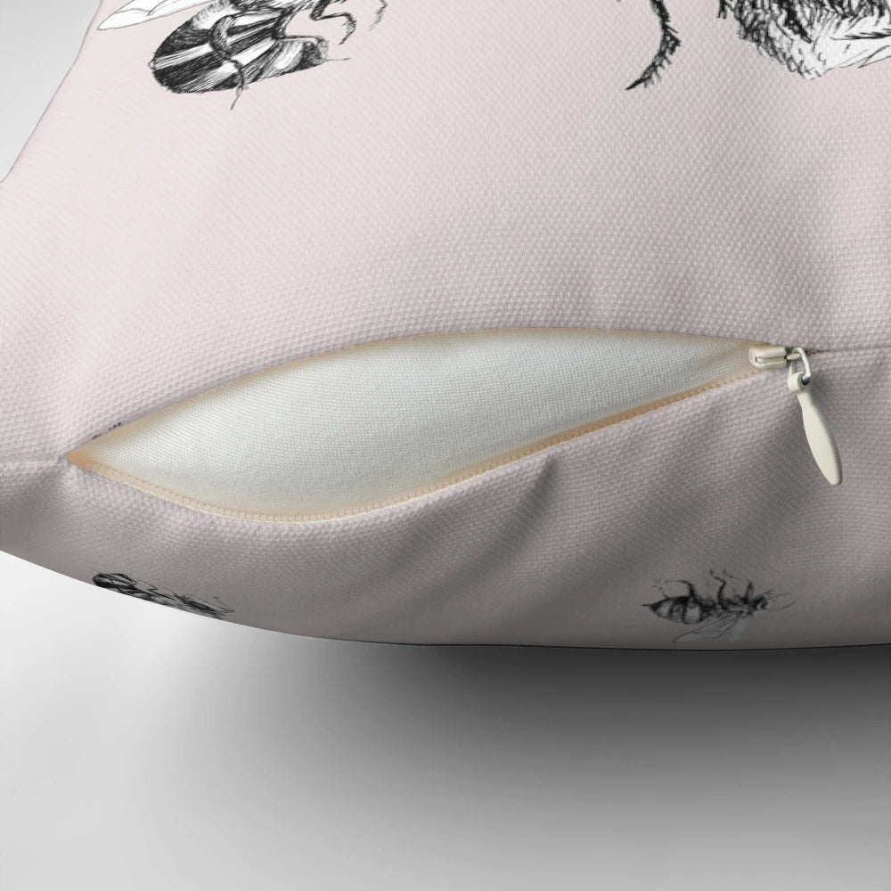 Vintage-inspired black and white ink illustration of a bumblebee on a decorative pillow for children's rooms and home decor.