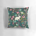 A cozy pillow featuring a whimsical pattern of forest animals and florals, perfect for kids' rooms and Mothers Day.