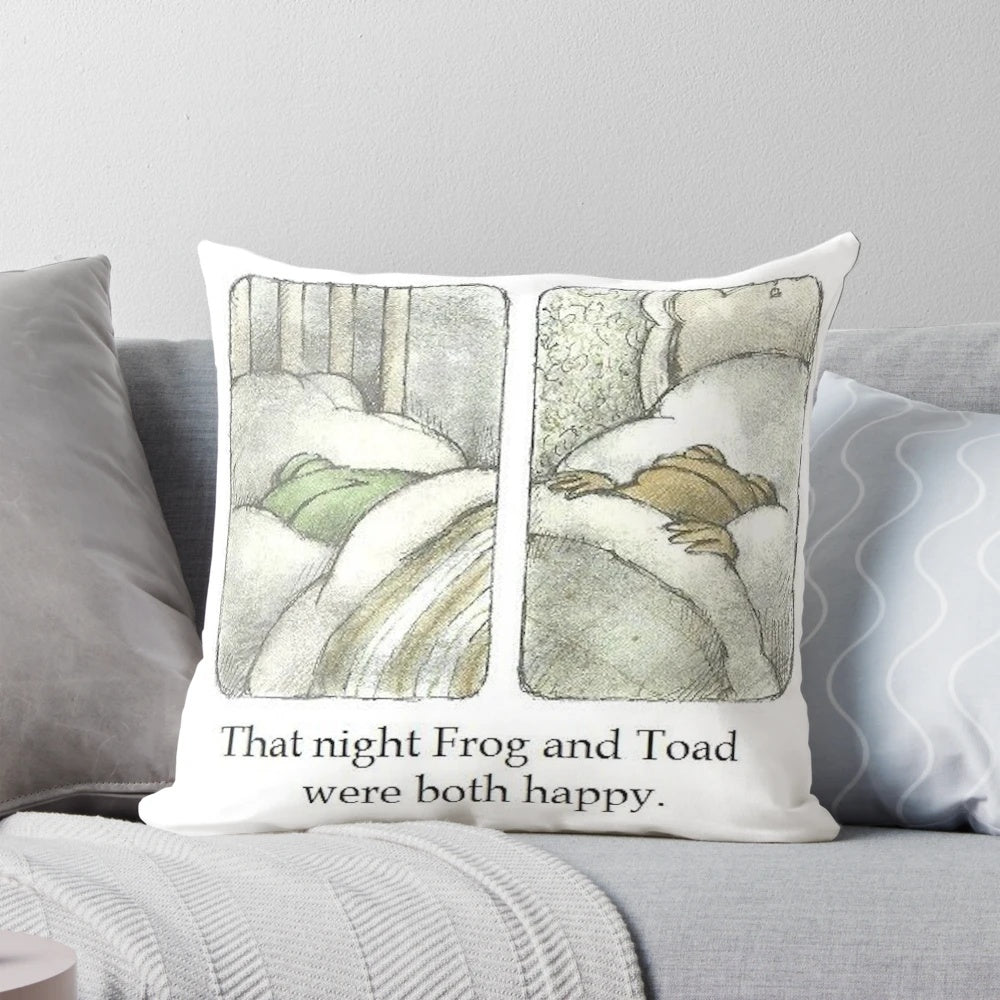 Colorful decorative pillow featuring illustrated frog and toad characters in a happy, whimsical design.