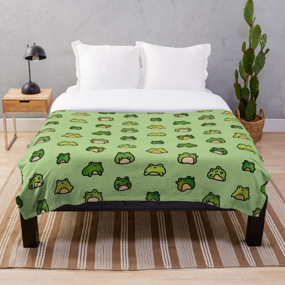 Cozy plush blanket featuring a whimsical design of doodled frogs