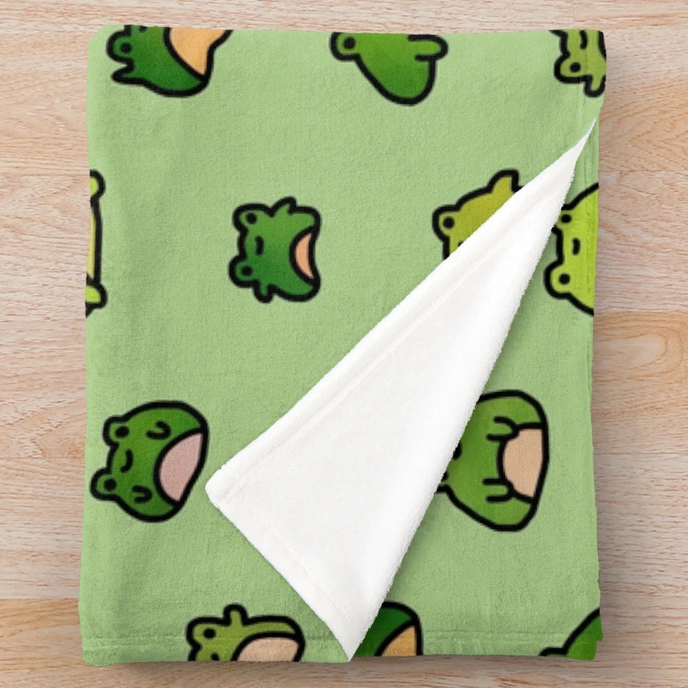 Cozy plush blanket featuring a whimsical design of doodled frogs