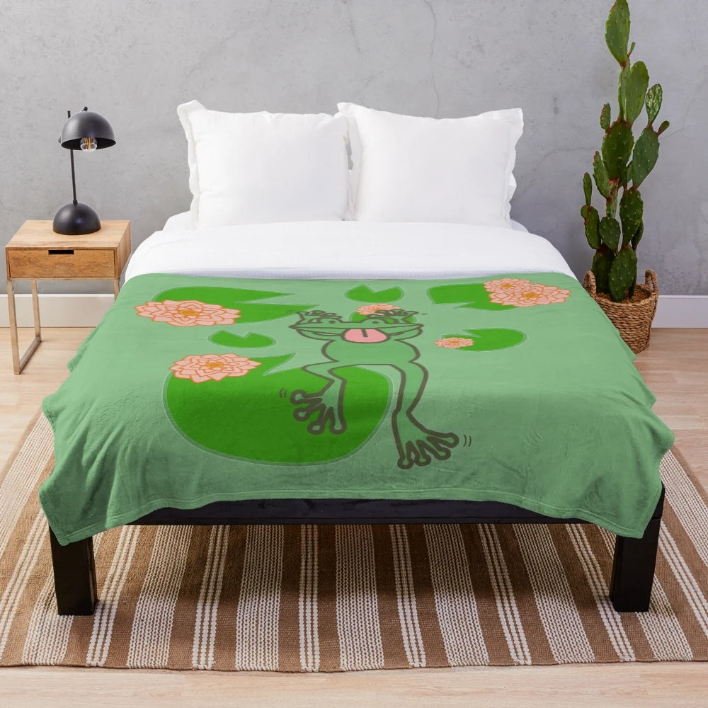 Whimsical frog plush blanket in green and pink floral design