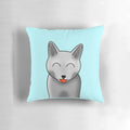 A cheeky gray cat with closed moon eyes printed on a soft, plush pillow.
