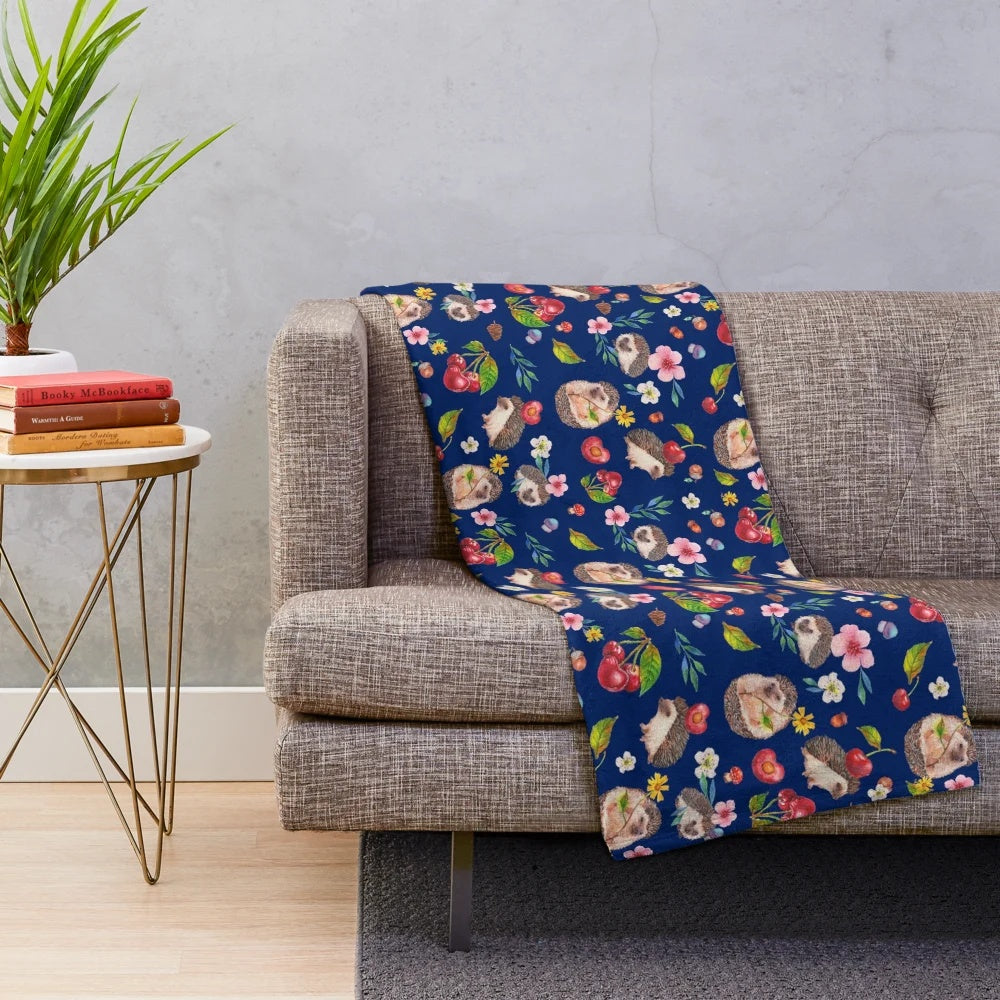 Cozy plush blanket featuring a watercolor hedgehog design with autumn florals and botanicals