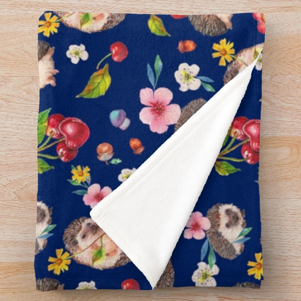 Cozy plush blanket featuring a watercolor hedgehog design with autumn florals and botanicals