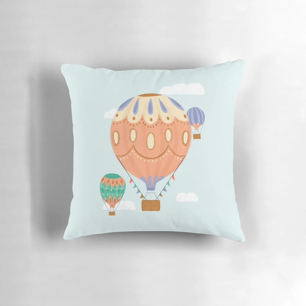 Colorful hot air balloon illustration on a plush pillow, perfect for a child's room or nursery